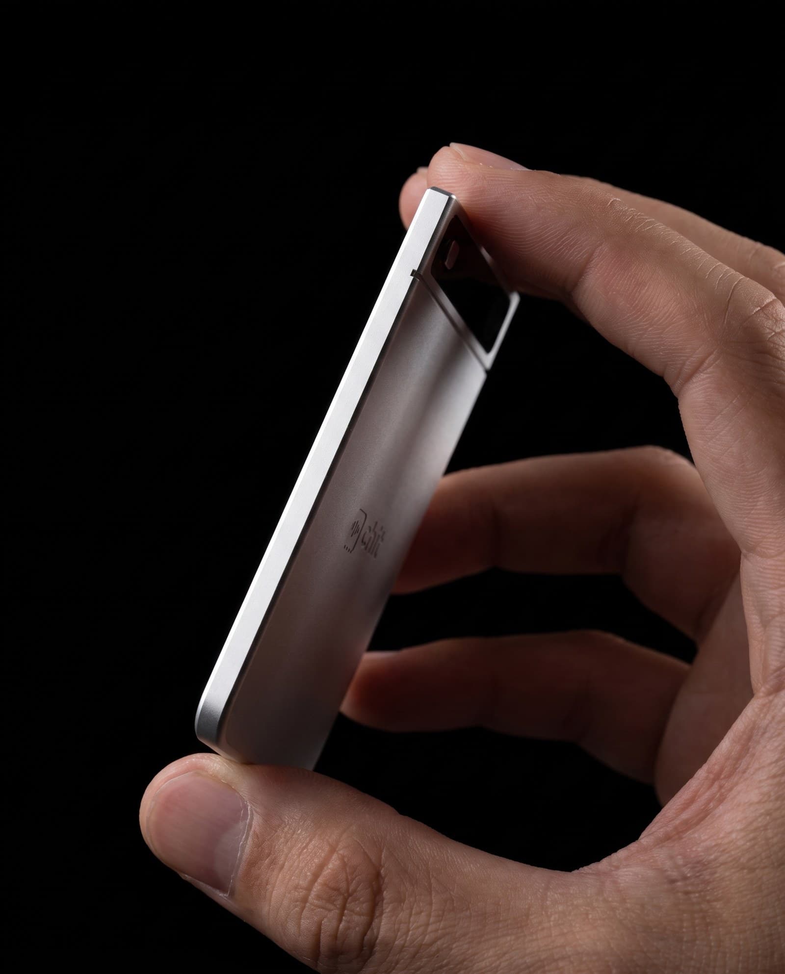 chit one edge on — 3.9 millimetres thin.